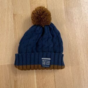 Blue and brown beanie with pompom